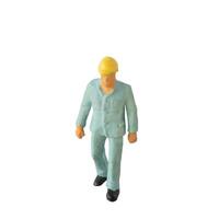 Miniature construction worker isolate on white background with clipping path photo
