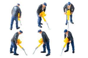 Miniature construction worker isolate on white background with clipping path photo