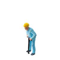 Miniature construction worker in a blue uniform isolate on white background with clipping path photo