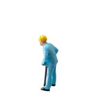 Miniature construction worker in a blue uniform isolate on white background with clipping path photo