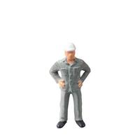 Miniature construction worker isolate on white background with clipping path photo