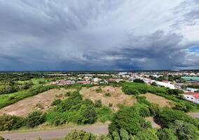 An aerial view of a town and a stormy sky photo