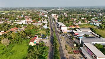 A view of a road and a town from above photo