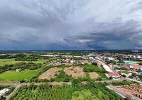 An aerial view of a town and a stormy sky photo