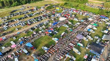An aerial view of a large parking lot with lots of cars photo