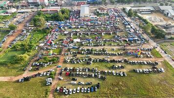 An aerial view of a large parking lot with lots of cars photo