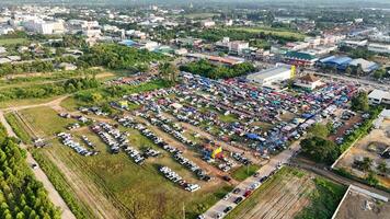 An aerial view of a large parking lot with lots of cars photo