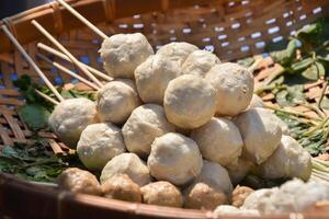 A basket filled with meatballs and vegetables photo