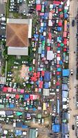 An aerial view of a large parking lot with lots of cars photo