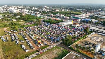 An aerial view of a large parking lot with lots of cars photo