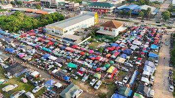 An aerial view of a large market with lots of tents photo