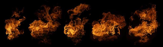 The set of fire and burning flame isolated on dark background for graphic design photo