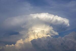 Large mushroom cloud that resemble atomic nuclear bomb explosion for war and atomic nuke concept photo