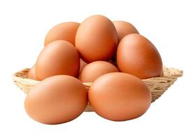 Group of fresh brown chicken eggs in stack in wicker basket isolated on white background with clipping path photo