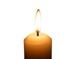 A single burning candle flame or light glowing on a big white candle isolated on white background with clipping path photo