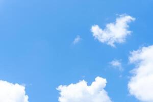 Low angle view of beautiful blue sky with strange shape of clouds in the morning or evening used as natural background texture in decorative art work photo