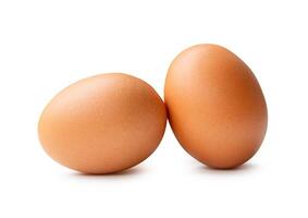 Side view of two fresh brown chicken eggs in stack isolated on white background with clipping path photo