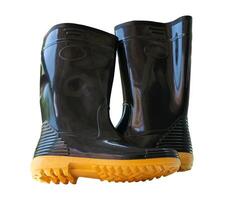 A pair of tall black gumboots or rubber boots isolated on white background with clipping path photo