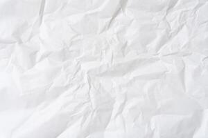Top view and full frame of wrinkled or crumpled white stencil paper texture used for wrinkled or crumpled white paper background texture in decorative art work photo