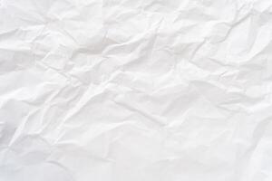 Top view and full frame of wrinkled or crumpled white stencil paper texture used for wrinkled or crumpled white paper background texture in decorative art work photo