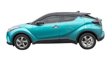 Side view of light blue hatchback car isolated on white background with clipping path photo