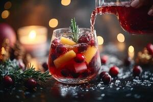 Holiday Cheer Sangria with Cranberries, Citrus, and Rosemary Poured into Elegant Glasses photo