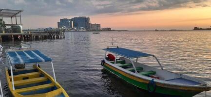 View of beauty sky jetty pannyua at Makassar Indonesia. Boats parked in docked afternoon photo