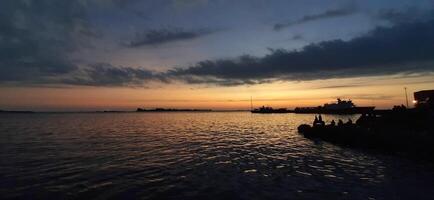 View of beauty sky jetty pannyua at Makassar Indonesia. Boats parked in docked afternoon photo