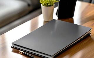 Mockup image of Black notebook in a table photo
