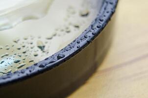 Close up of wet magnifying glass with customizable space for text or ideas photo