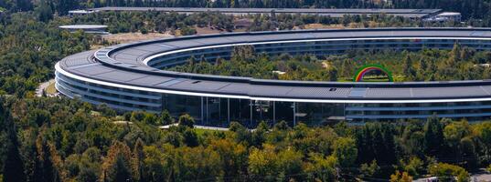 Aerial View of Apple Park Campus with Solar Panels and Rainbow Arch photo