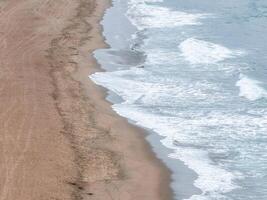 Aerial View of Serene Sandy Beach with Gentle Waves in San Francisco photo