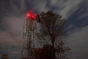 Telecommunication antenna under night sky photo