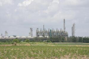 factory infront from green grass under cloudy sky photo