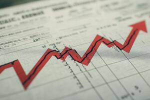 An isolated red downward arrow crashes through a financial graph, indicating a dramatic decline in market trends. This visual emphasizes the urgency of the situation in economic contexts. photo