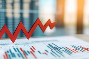 A striking red arrow points downward, crashing through a chart showcasing fluctuating stock prices. This visual represents a drop in market performance and investor sentiment. photo