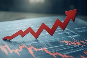 A striking red arrow points downward, breaking through various data points on a financial chart within a modern workspace. The design symbolizes a significant decline or drop in values. photo