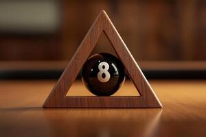 A single snooker ball, marked with the number 8, sits in the center of a triangular wooden rack, surrounded by a polished surface that highlights its glossy finish. photo