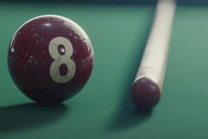 An isolated snooker ball is positioned beside a cue stick on a green felt table, creating a calm and focused atmosphere perfect for a game. The room is dimly lit, enhancing the tranquil mood. photo