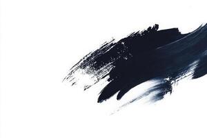 Vivid brush strokes of deep blue paint cascade across a pristine white canvas, creating a striking contrast. The bold marks reflect artistic expression and creativity in a minimalist setting. photo