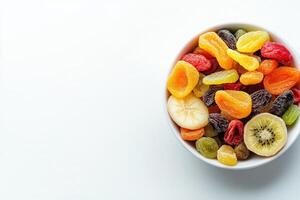 An inviting bowl filled with various dried fruits sits on a pristine white background. The vibrant colors and textures create an appealing display, perfect for snacking or decoration. photo