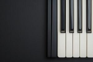 The arrangement showcases black and white piano keys against a solid dark background, emphasizing the elegance and simplicity of the instrument, perfect for musical inspiration and creativity. photo