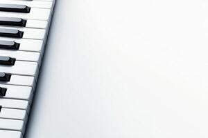 The image features a close-up view of black and white piano keys set on a pristine, solid backdrop. The arrangement highlights the elegance and simplicity of the musical instrument. photo