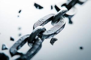 The visual representation of a broken chain highlights the fragility of financial connections, illustrating the potential harm of economic breakdowns in a minimalist design. photo