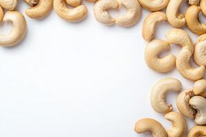 A cluster of raw cashews is artistically arranged on a minimalist white background, highlighting their unique shapes and textures, perfect for culinary or health-related projects. photo