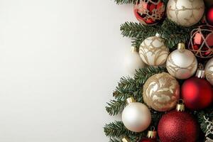 Vibrant Christmas tree ornaments in red, gold, and white are nestled among evergreen branches, creating a festive atmosphere perfect for holiday celebrations and seasonal decor. photo
