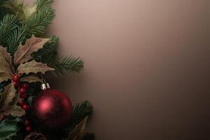 A collection of vibrant Christmas tree ornaments is carefully placed among lush evergreen branches and holly leaves, creating a festive atmosphere perfect for the holiday season. photo