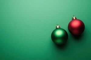 Two vibrant Christmas tree ornaments, one green and one red, beautifully placed on a clean solid background, evoking a festive and cheerful holiday spirit. photo