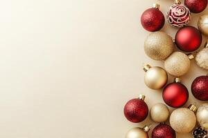 An assortment of colorful Christmas tree ornaments is elegantly placed on a solid, clean surface. The festive decorations add a warm touch, perfect for holiday celebrations. photo