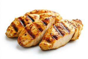 Tender grilled chicken slices are artistically arranged at the center of a bright white background, showcasing the enticing grill marks and juicy texture, perfect for a delicious meal. photo